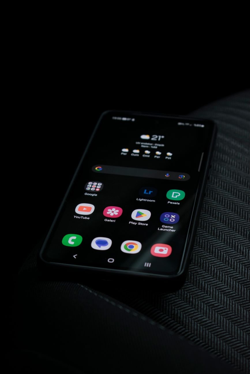 Close-up of a smartphone displaying apps — Bella Creates app walkthrough format