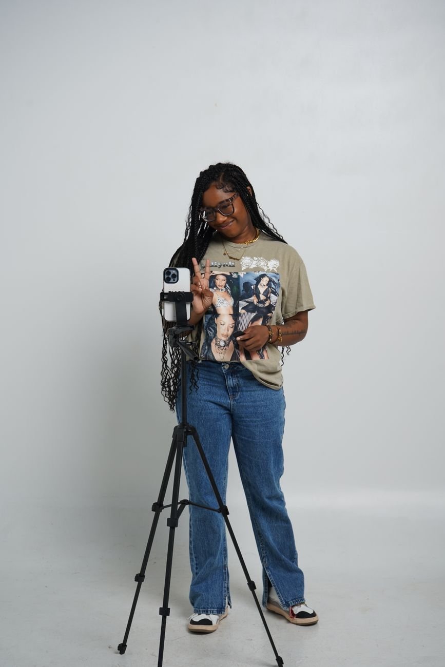 Content creator with camera setup in studio — talking-head format